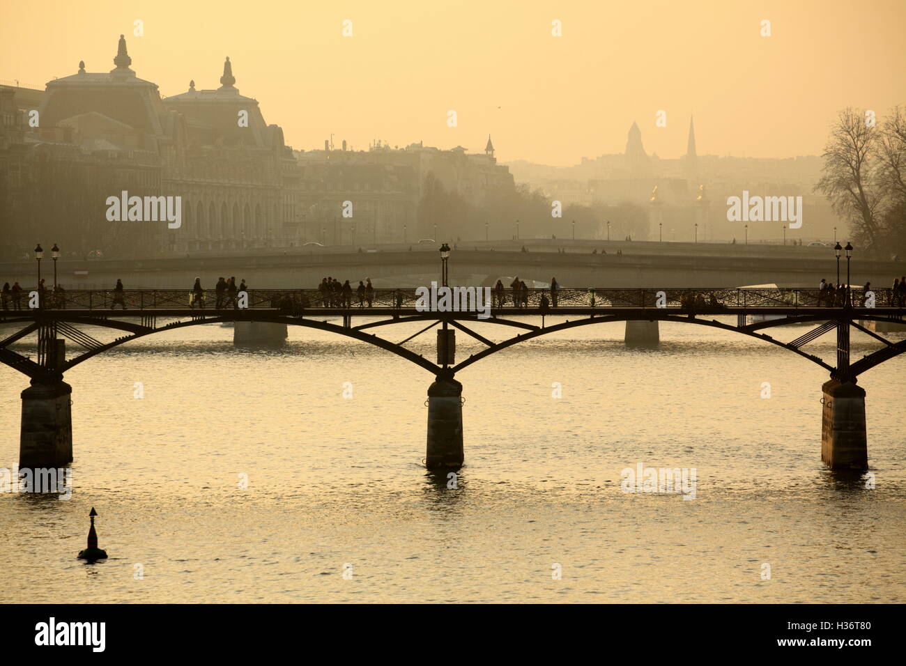 Passerelle des Arts aka Pont des Arts (Bridge of the Arts) over River Seine during sunset. Paris. France Stock Photo