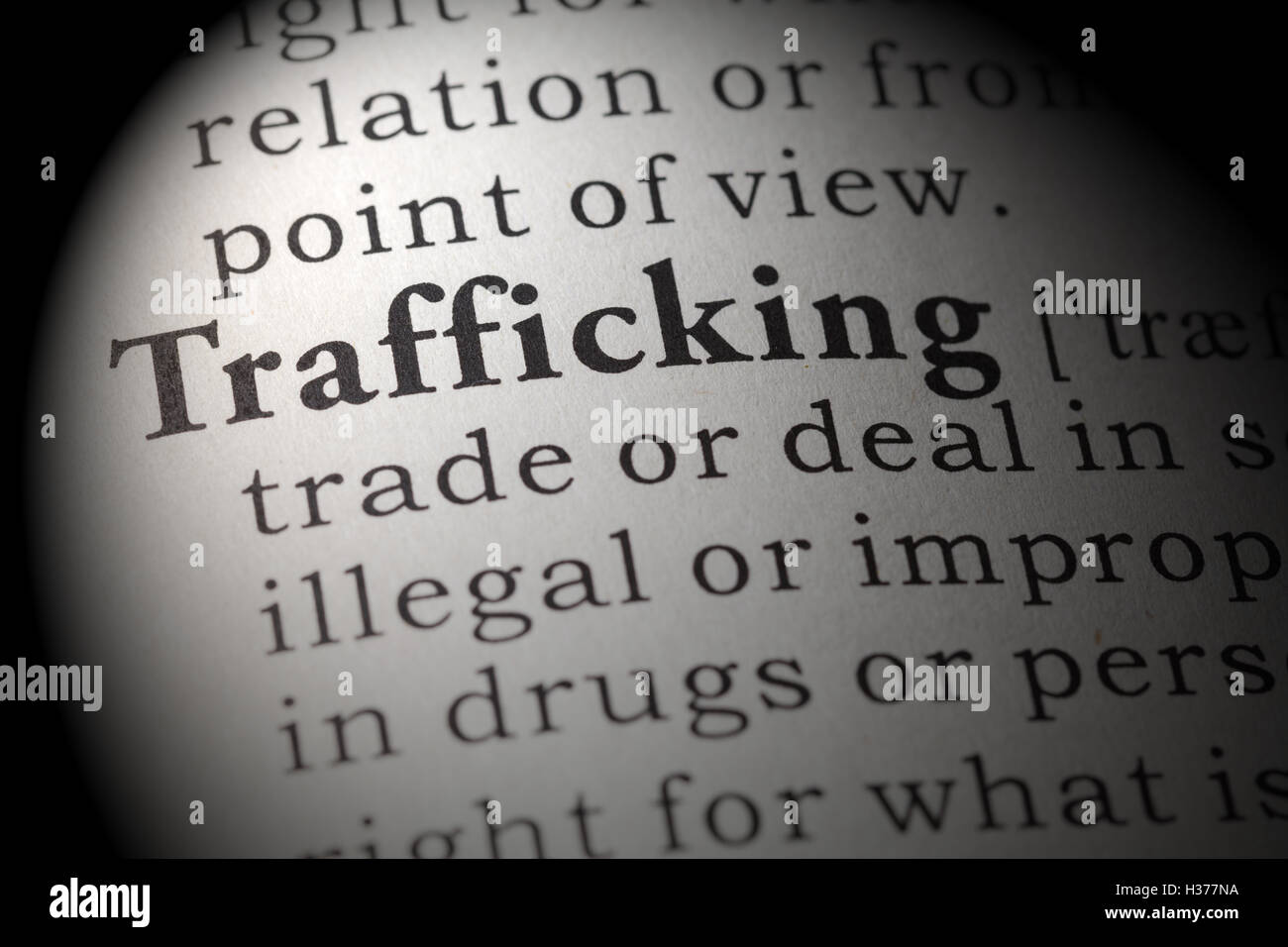 Fake Dictionary, Dictionary definition of the word trafficking. Stock Photo