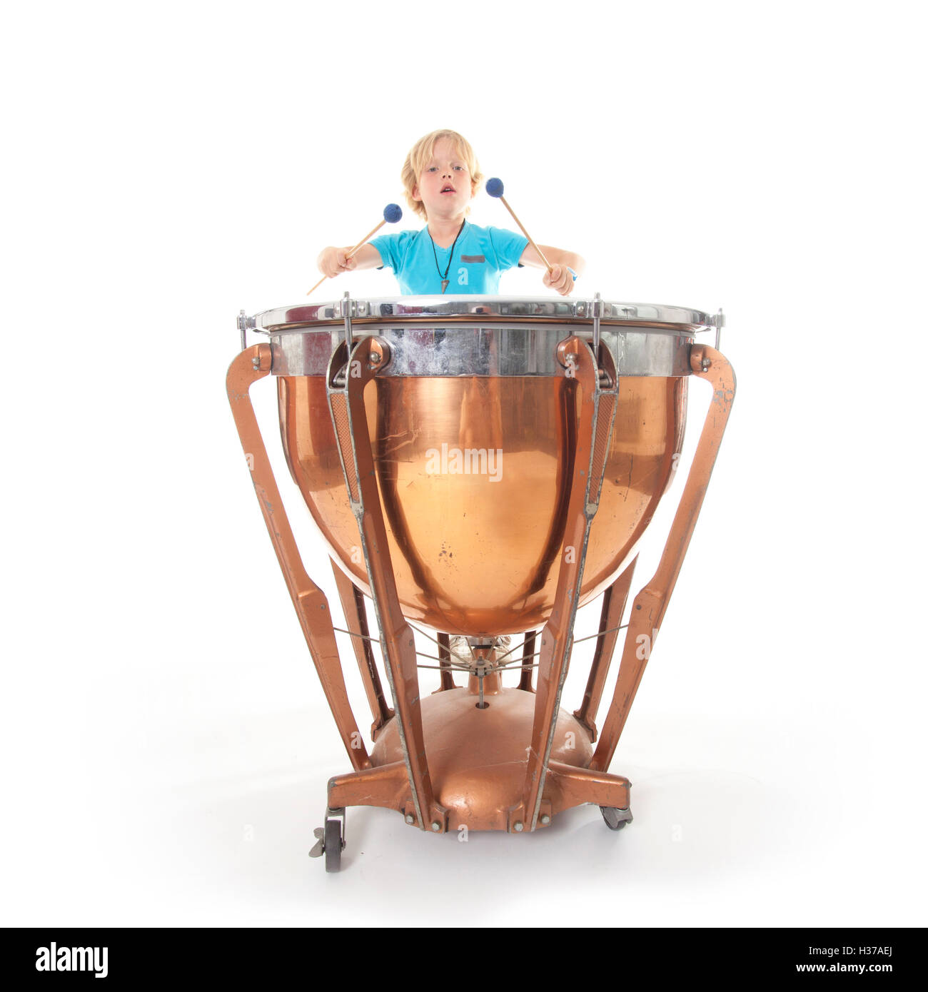 young boy playing kettledrum Stock Photo Alamy