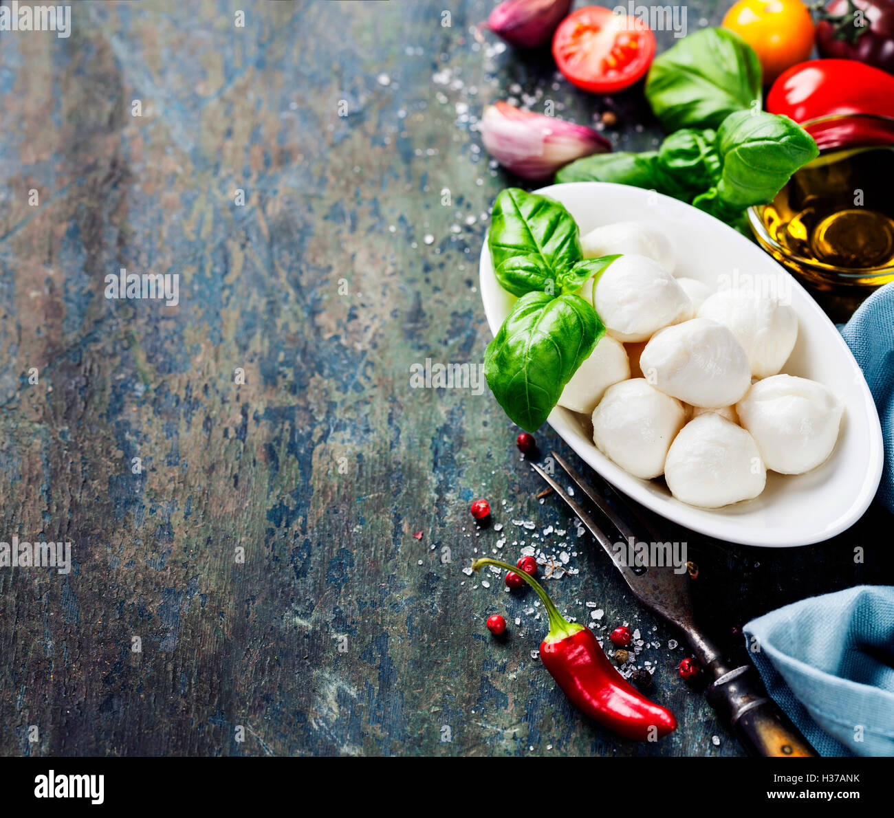 Mozzarella with tomatos and basil leaves Stock Photo - Alamy