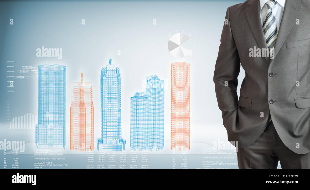 Businessman with high-tech skyscrapers and graphs Stock Photo - Alamy