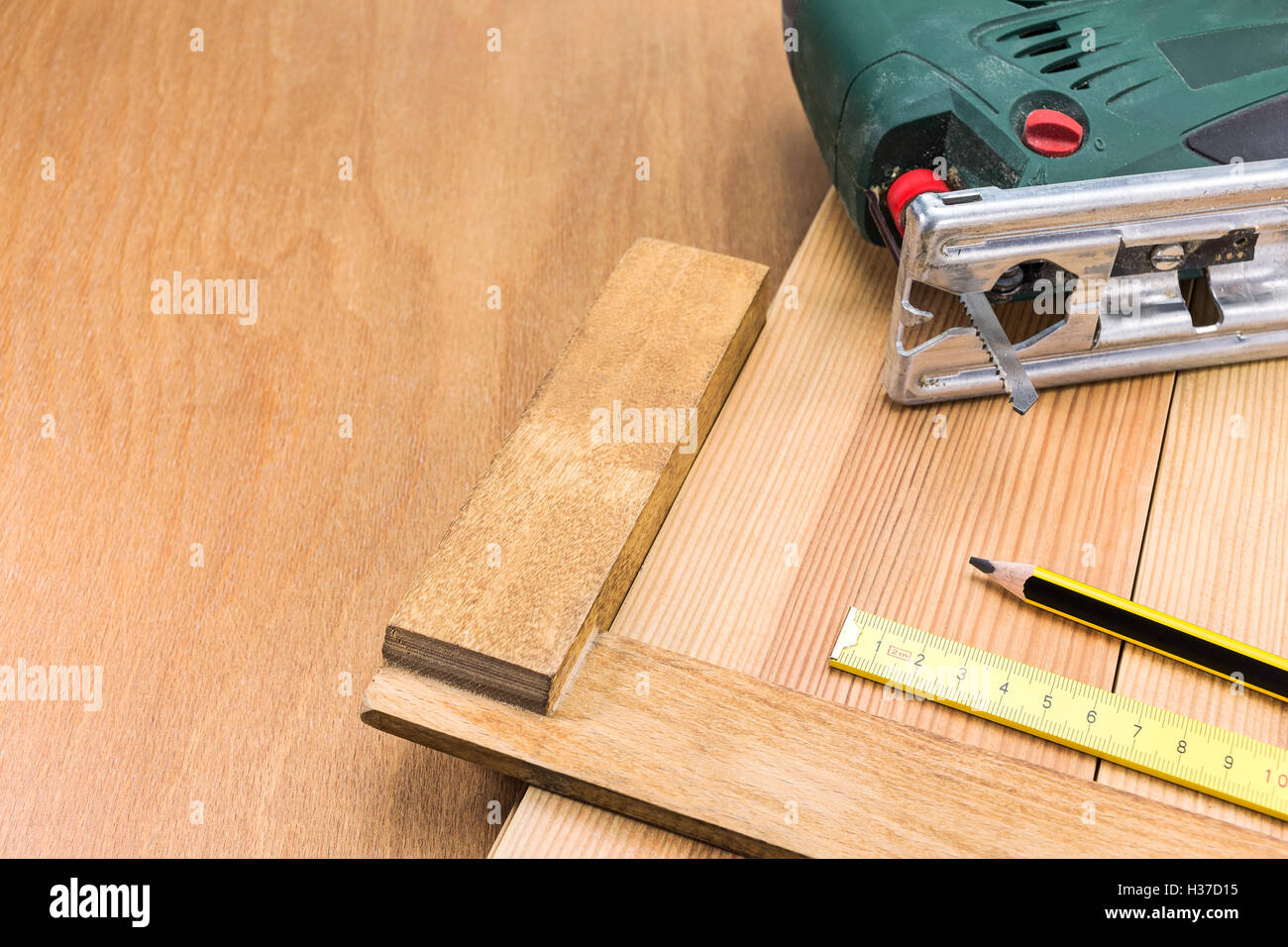 Carpenter's electric fret-saw tool on a workbench Stock Photo
