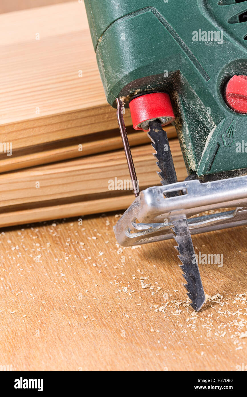 Carpenter's electric fret-saw tool on a workbench Stock Photo