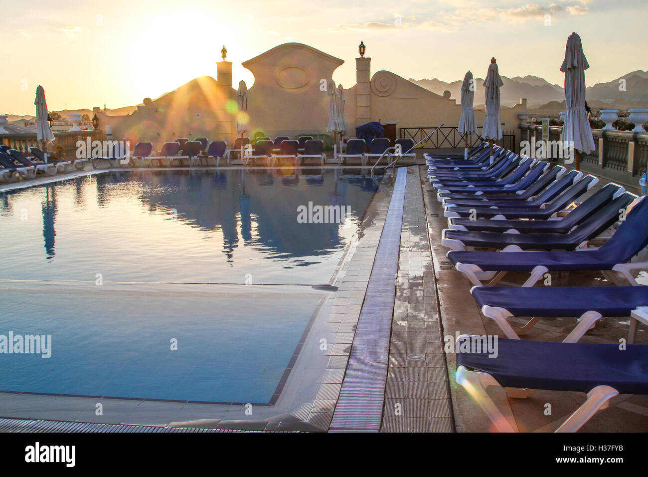Chairs by the pool Stock Photo Alamy