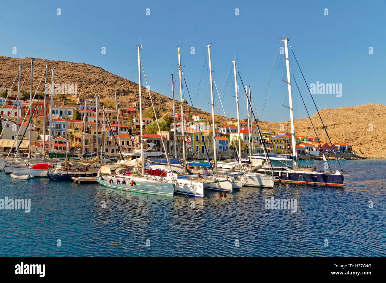 Small marina and pontoons in Chalki, Island of Chalki, Dodecanese Islands,Greece. Stock Photo