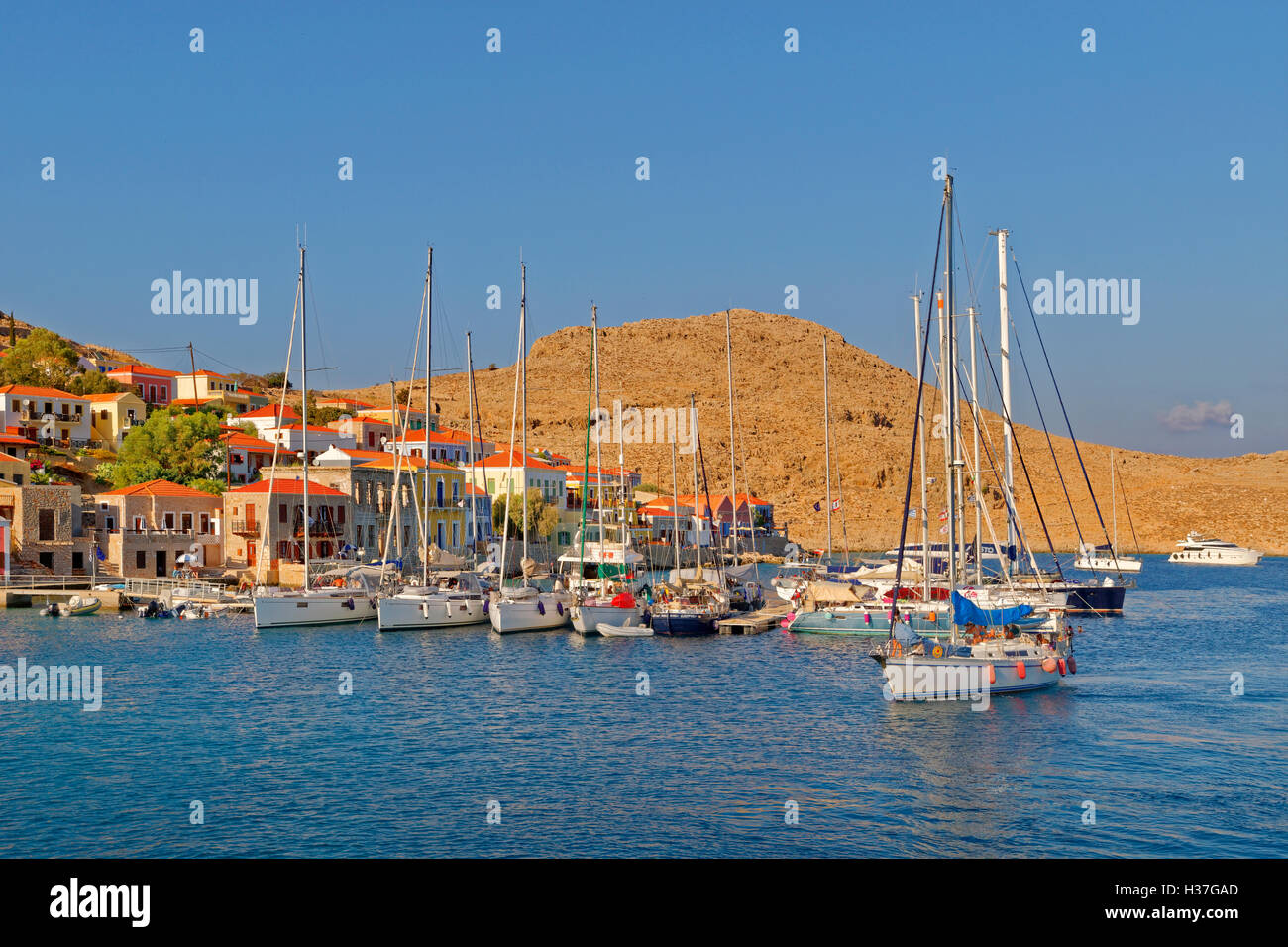 Private sailing yacht arriving at small marina and pontoons in Chalki