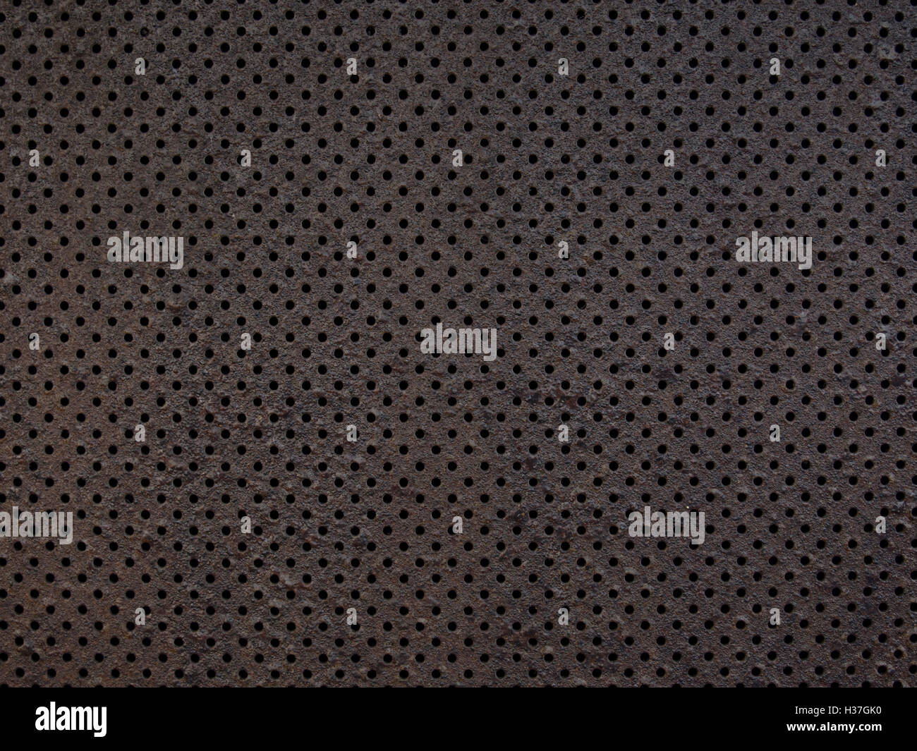 perforated metal texture background Stock Photo