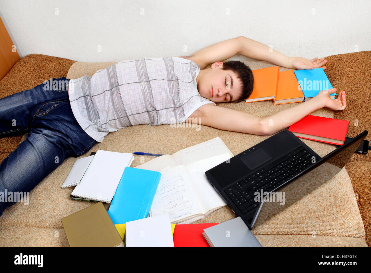 Teenager sleeps after Learning Stock Photo