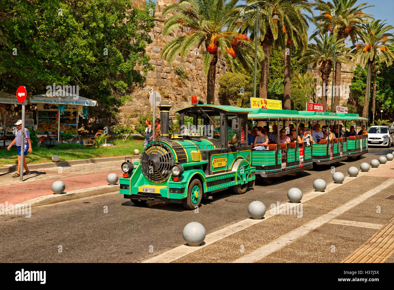 Tourist Road Train in Kos town, Island of Kos, Dodecanese group, Aegean, Greece. Stock Photo