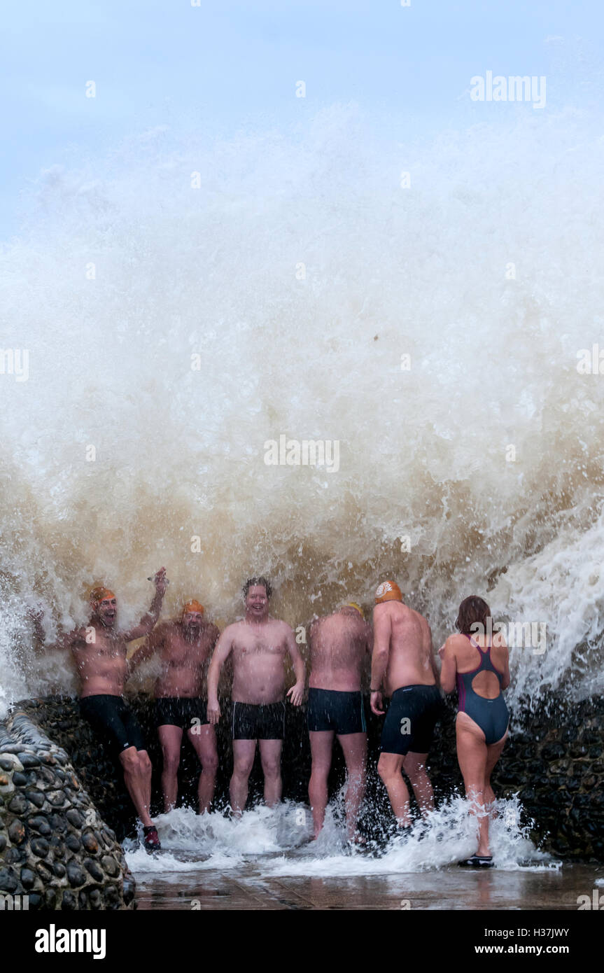 Members of Brighton Swimming Club enjoy a 'groyne shower' when the sea