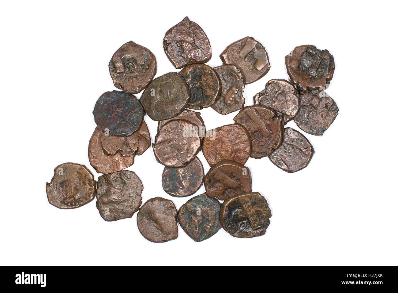 Many ancient bronze coins on white Stock Photo