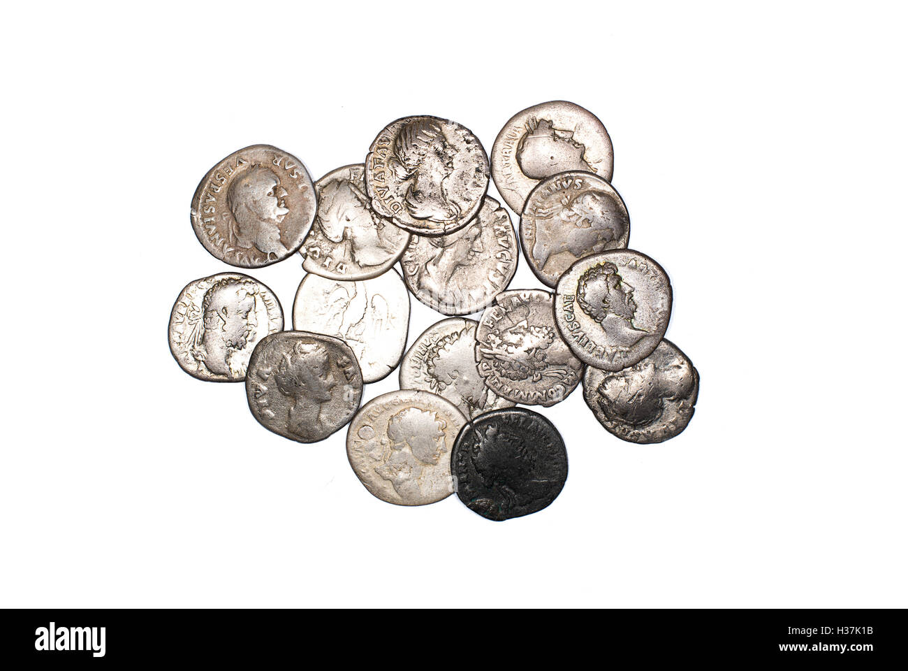 Many ancient silver coins on white Stock Photo