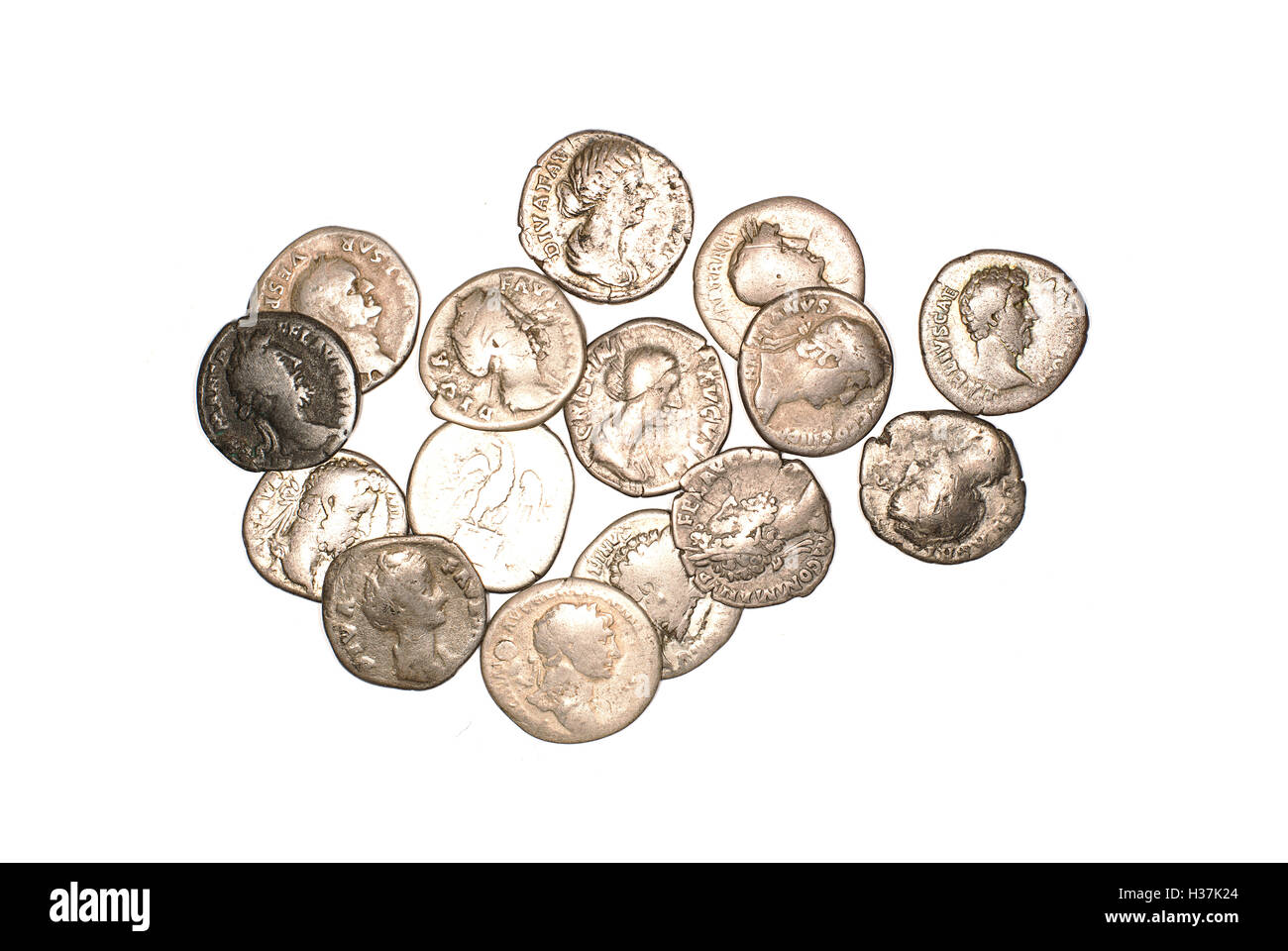 Many ancient silver coins on white Stock Photo