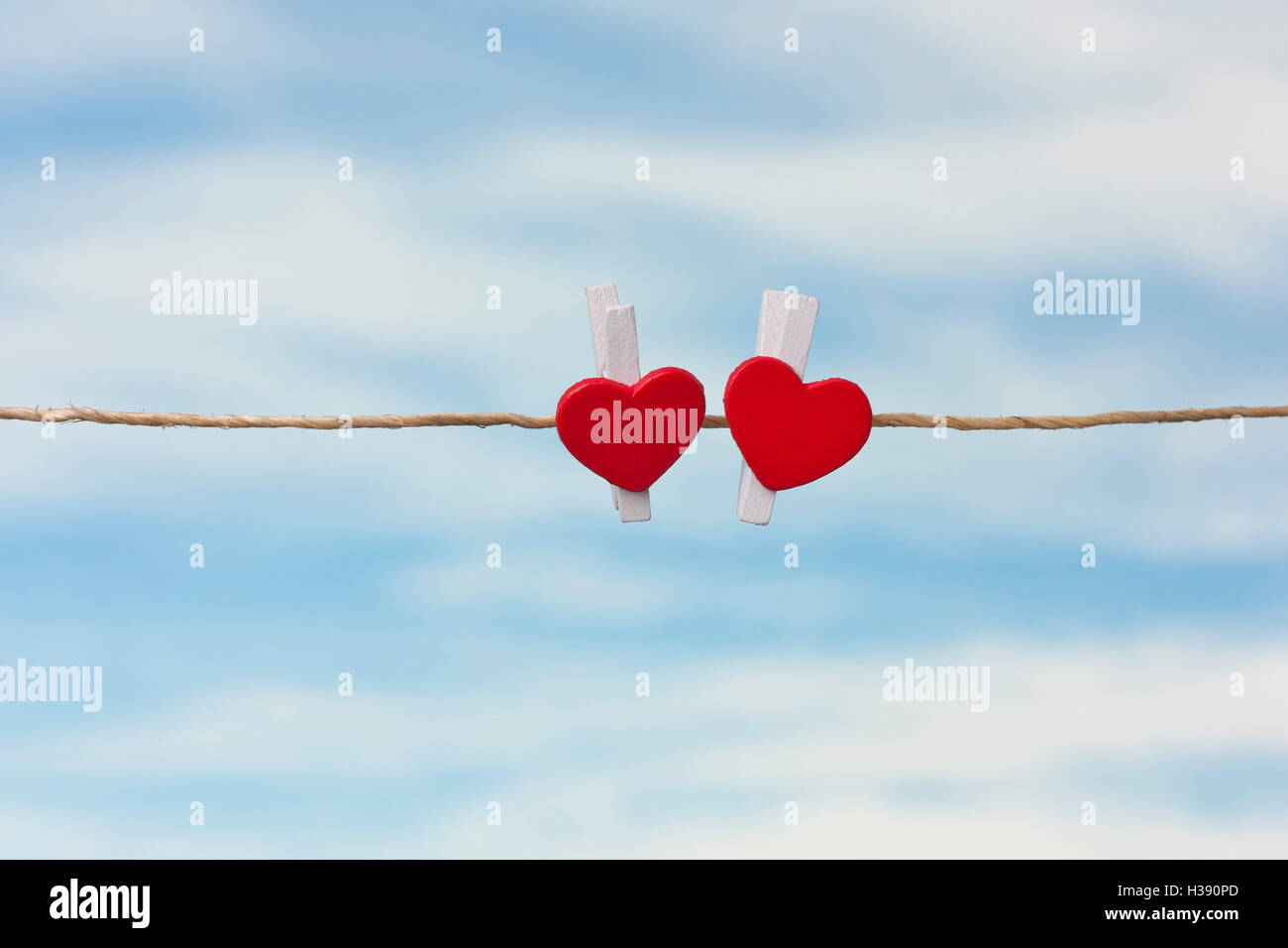 two red hearts on a background of the sky, concepts,Valentine Day Stock Photo
