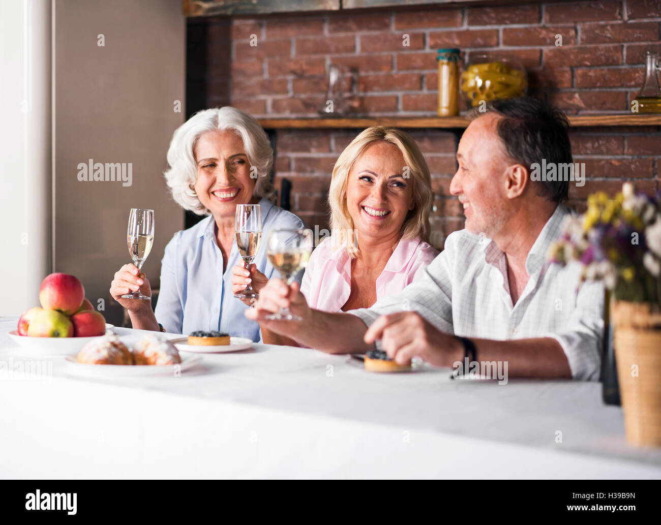 Smiling family enjoying the holiday meal Stock Photo