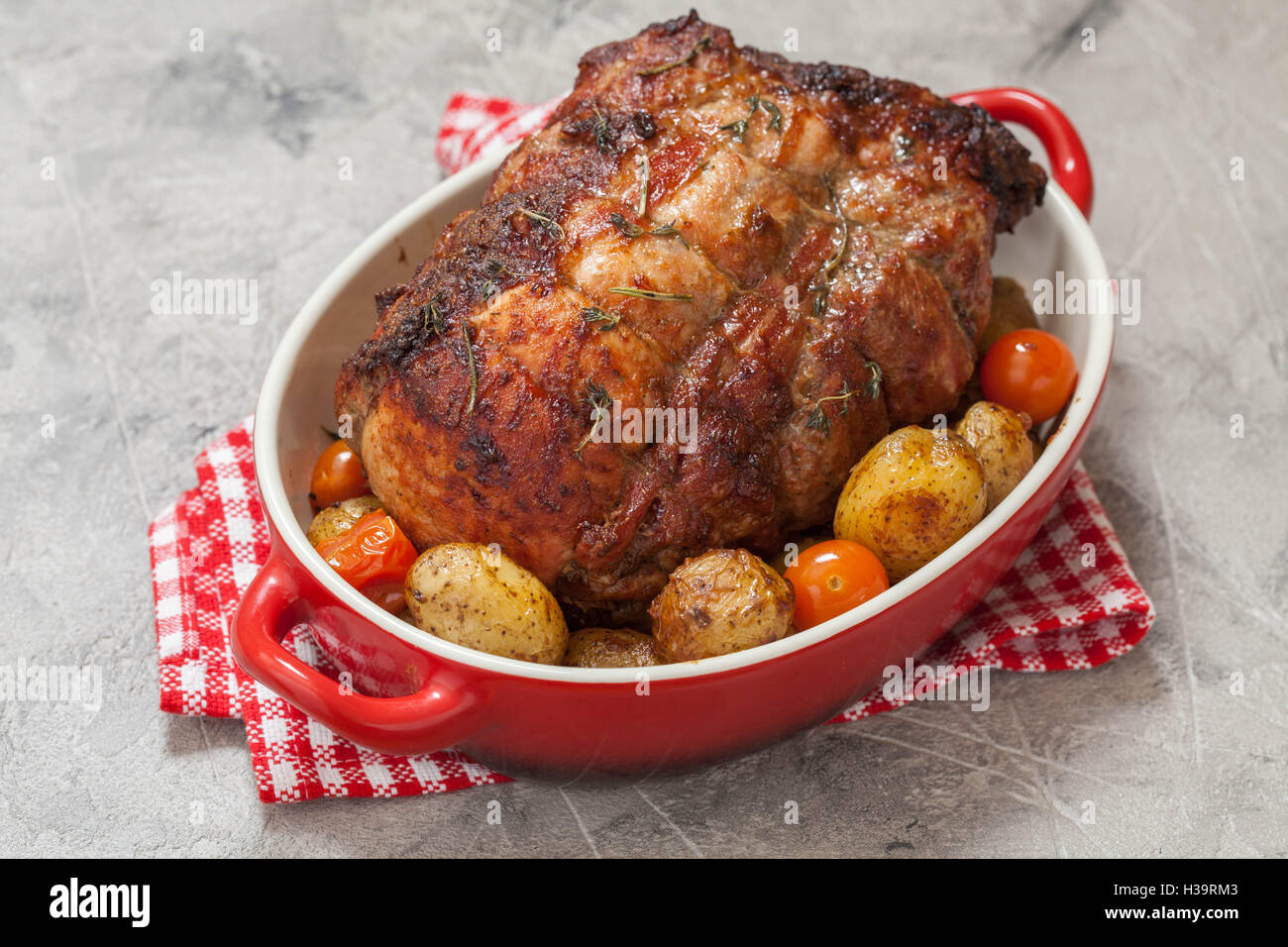 Boneless Pork Loin Roast with potatoes Stock Photo