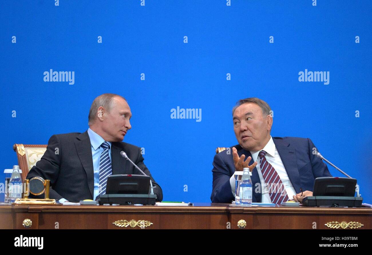Russian President Vladimir Putin chats with Kazakhstan President ...
