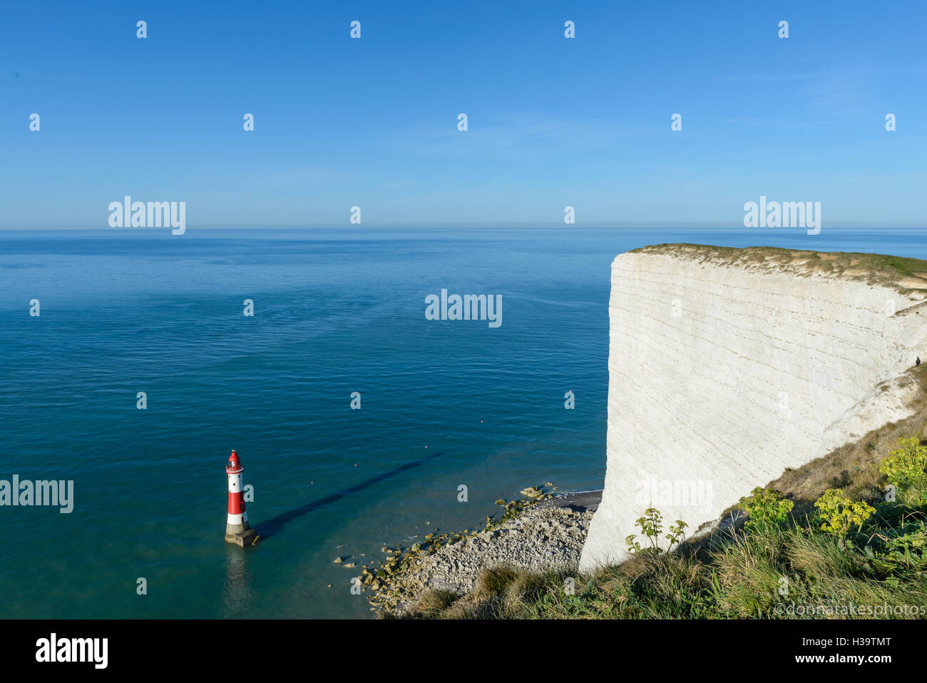 Beachy Head lighthouse and white chalk cliffs Stock Photo