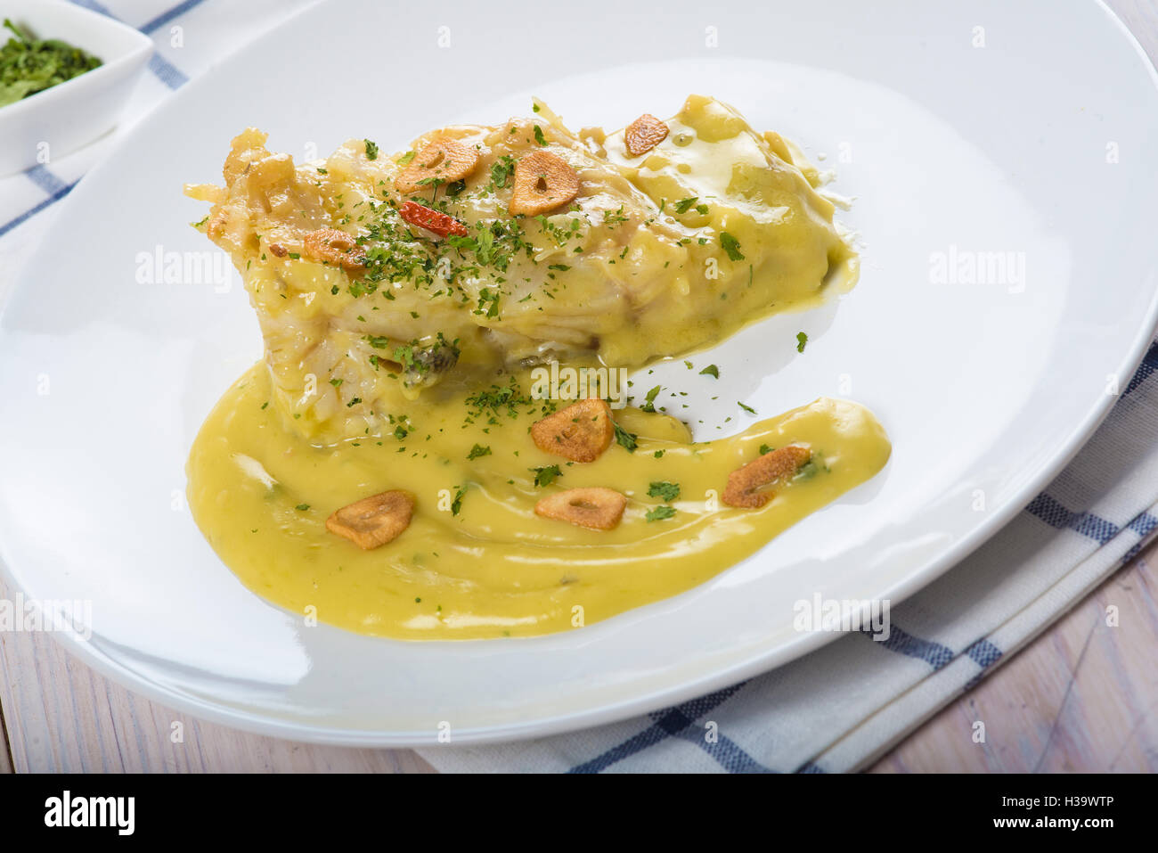 Salt cod in a pilpil sauce a typical Spanish recipe Stock Photo Alamy