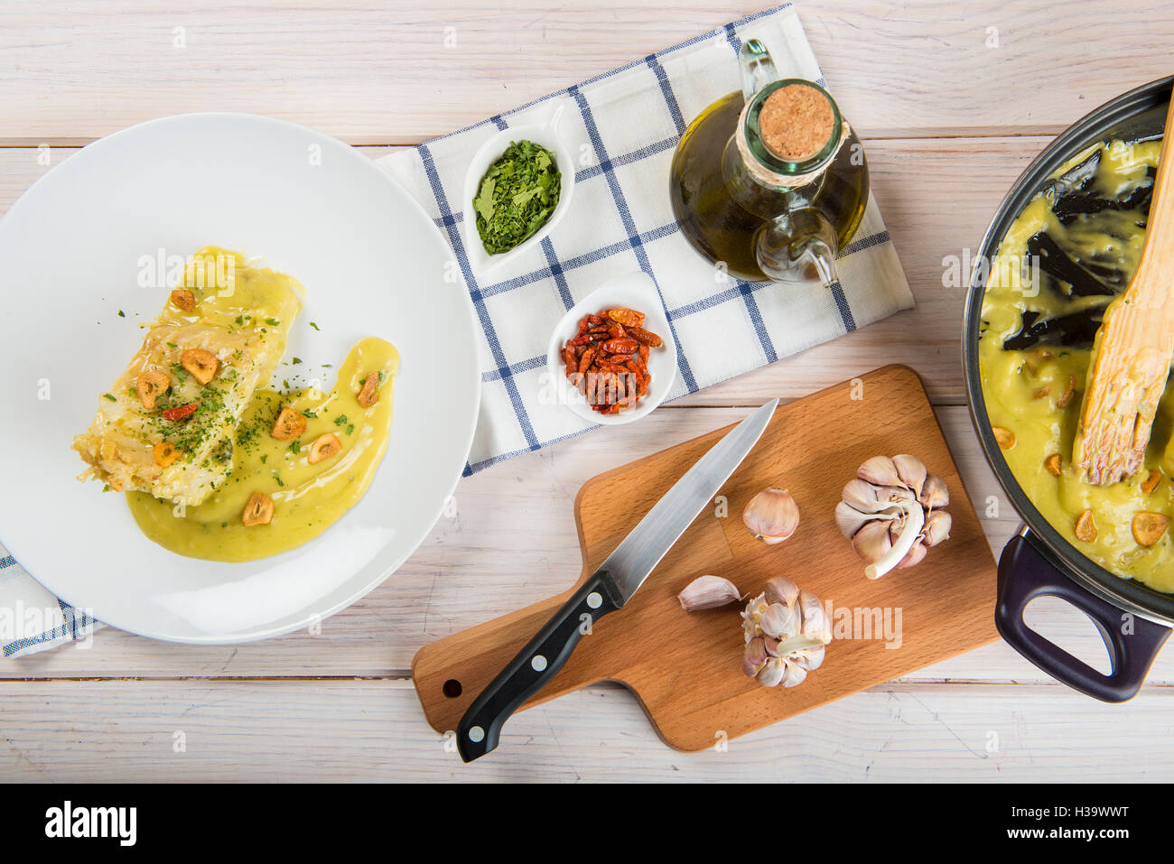 Salt cod in a pilpil sauce a typical Spanish recipe Stock Photo Alamy