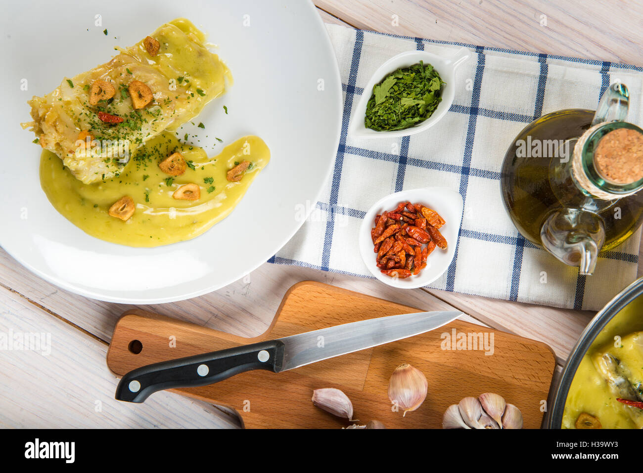 Salt cod in a pilpil sauce a typical Spanish recipe Stock Photo Alamy