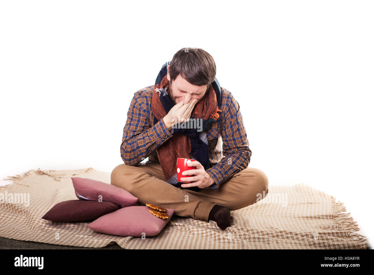 healthcare and medicine concept - ill man with flu at home Stock Photo