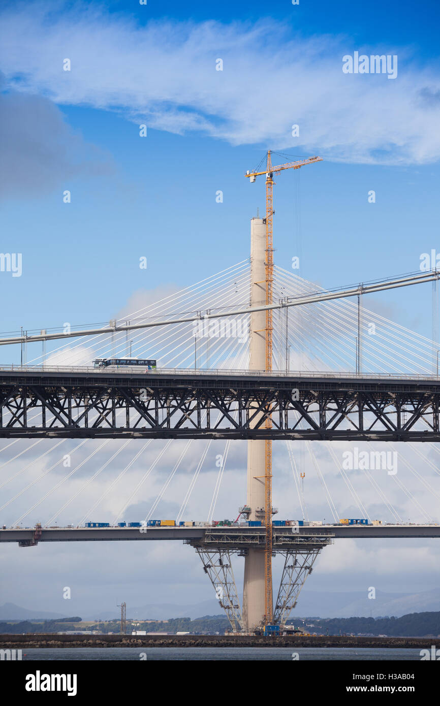 The Forth Road Bridge with the new Queensferry Crossing being built behind. Stock Photo