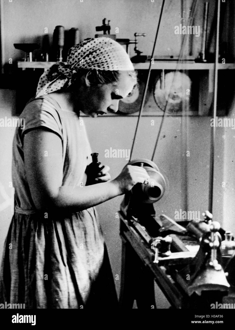 Woman at a lathe in the Colonial School for Women at Rendsburg, 1933 ...