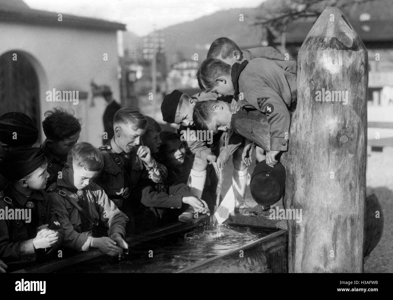 Members of the Deutsches Jungvolk drinking at the fountain, 1937 Stock Photo