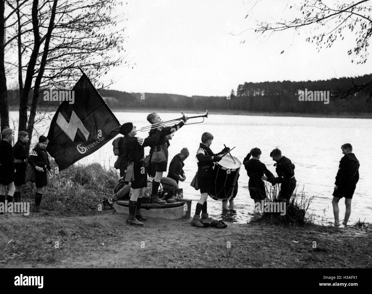 Jungvolk boys playing music outdoors, 1934 Stock Photo