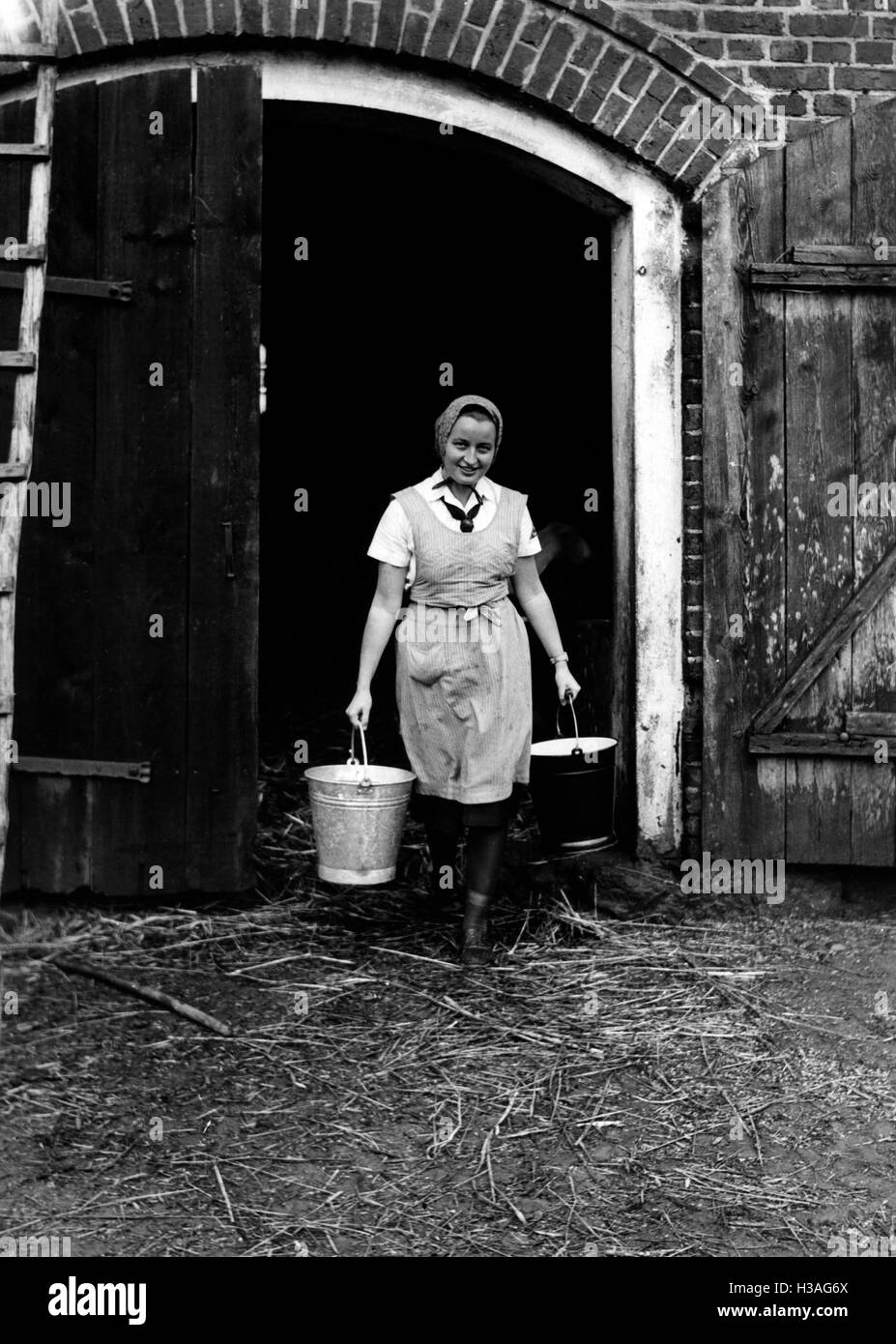 BDM girl working in the shed, 1940 Stock Photo