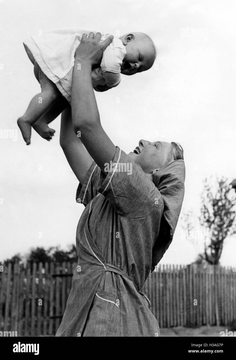 BDM girl as child care worker, 1941 Stock Photo