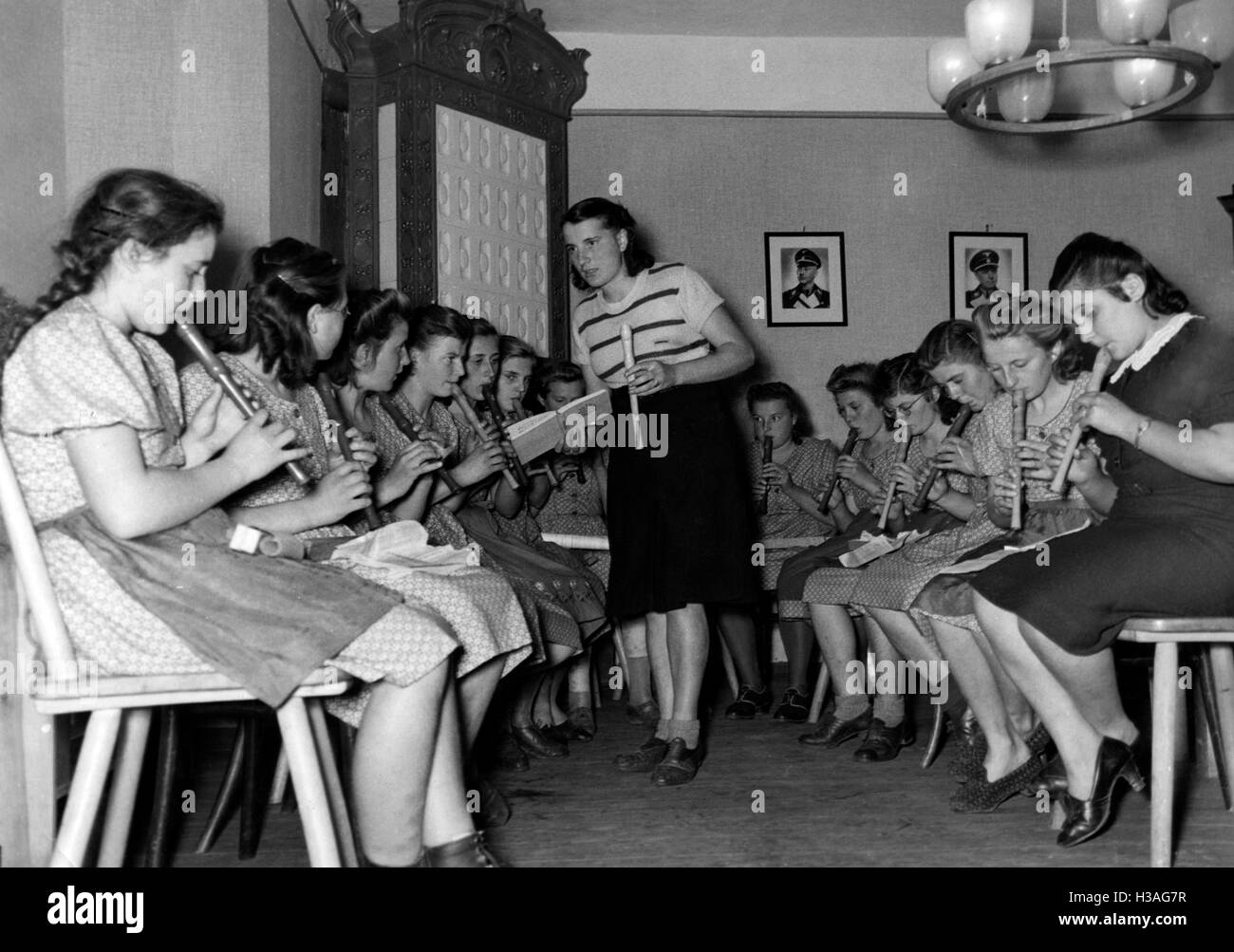 Landjahrmaedel playing music, 1941 Stock Photo
