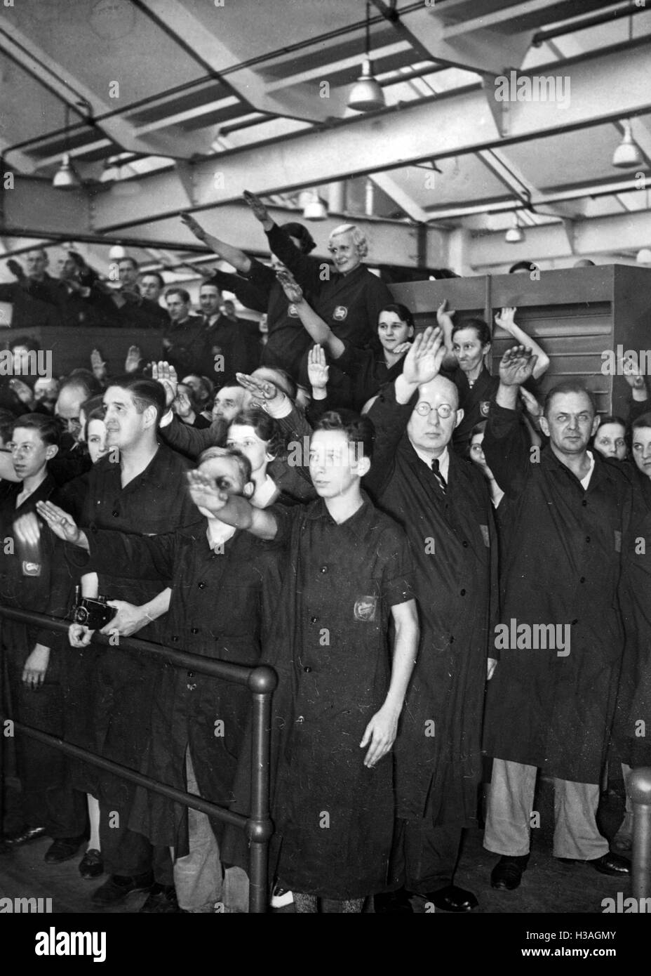 Workers showing the Nazi salute in Berlin, 1938 Stock Photo