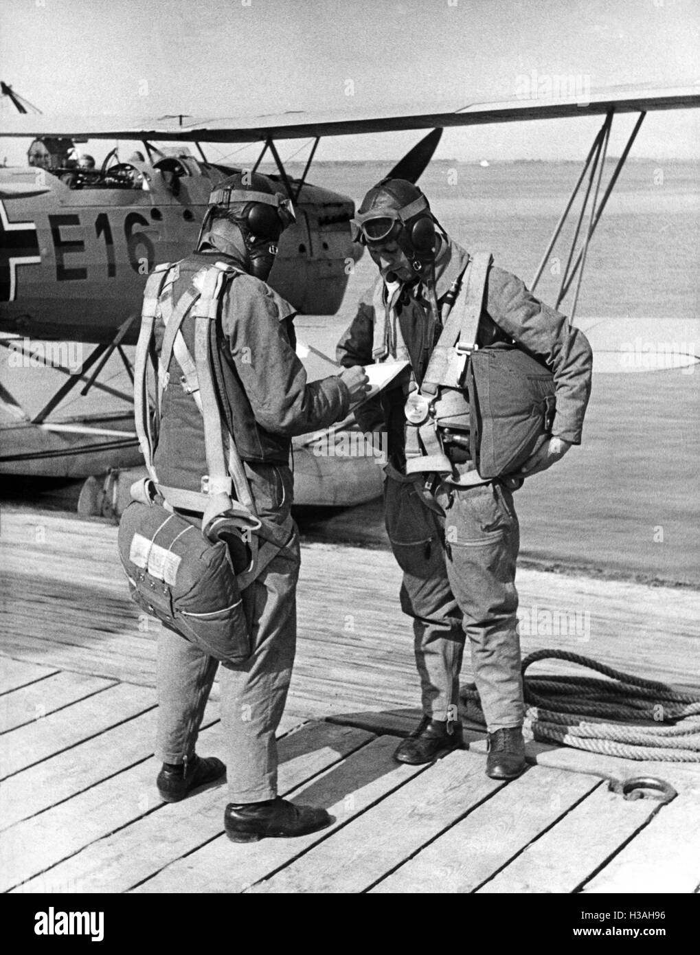 Pilot and navigator studying a map, 1937 Stock Photo