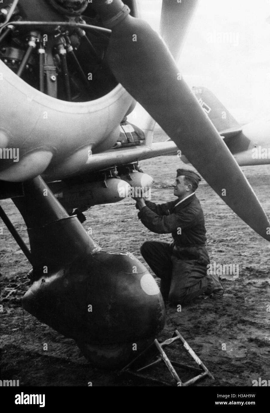 Examination of the bomb suspension of a dive bomber aircraft, 1939 Stock Photo