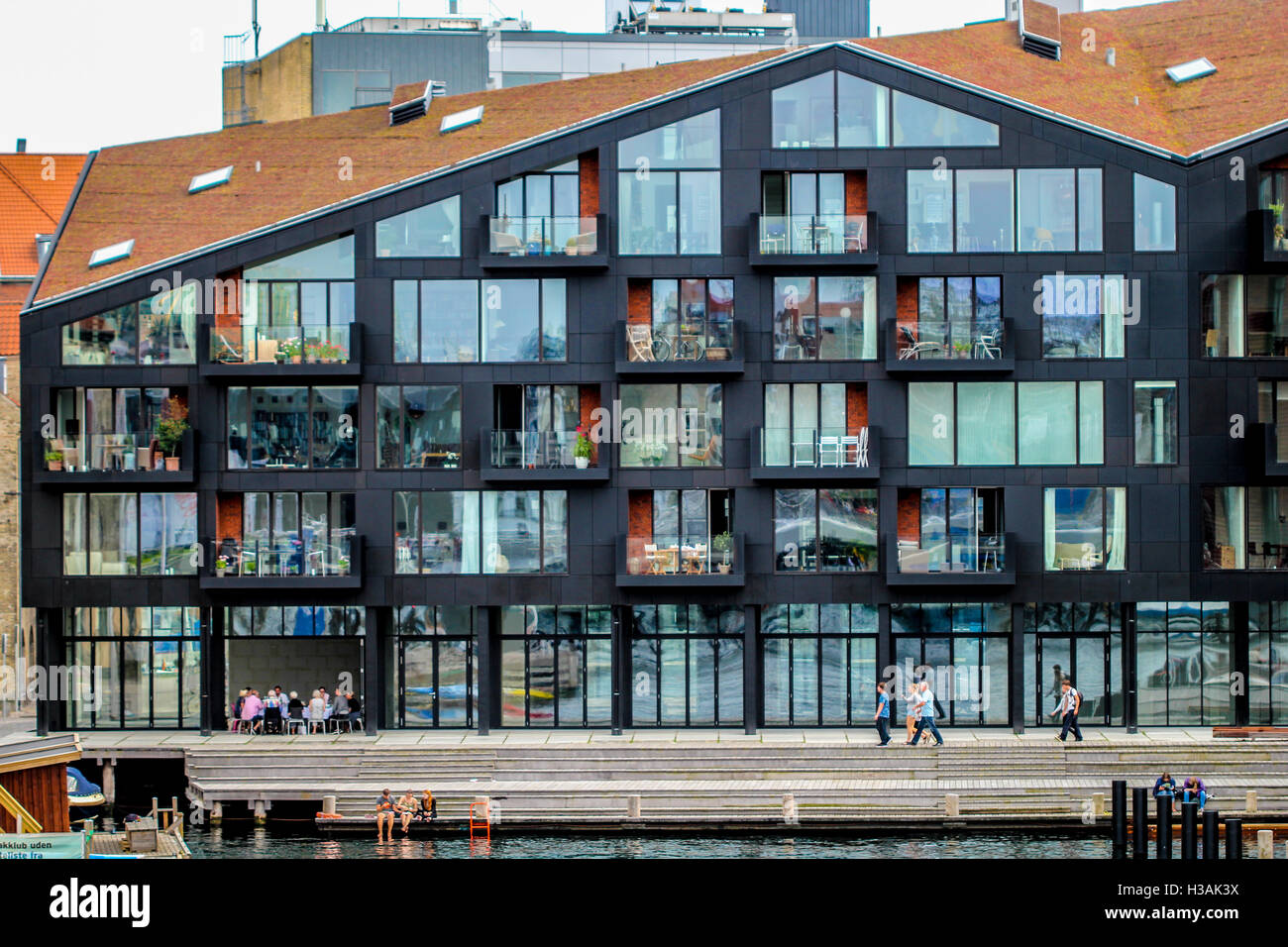 Image showcasing Scandinavian houses with a lot of windows Stock Photo - Alamy