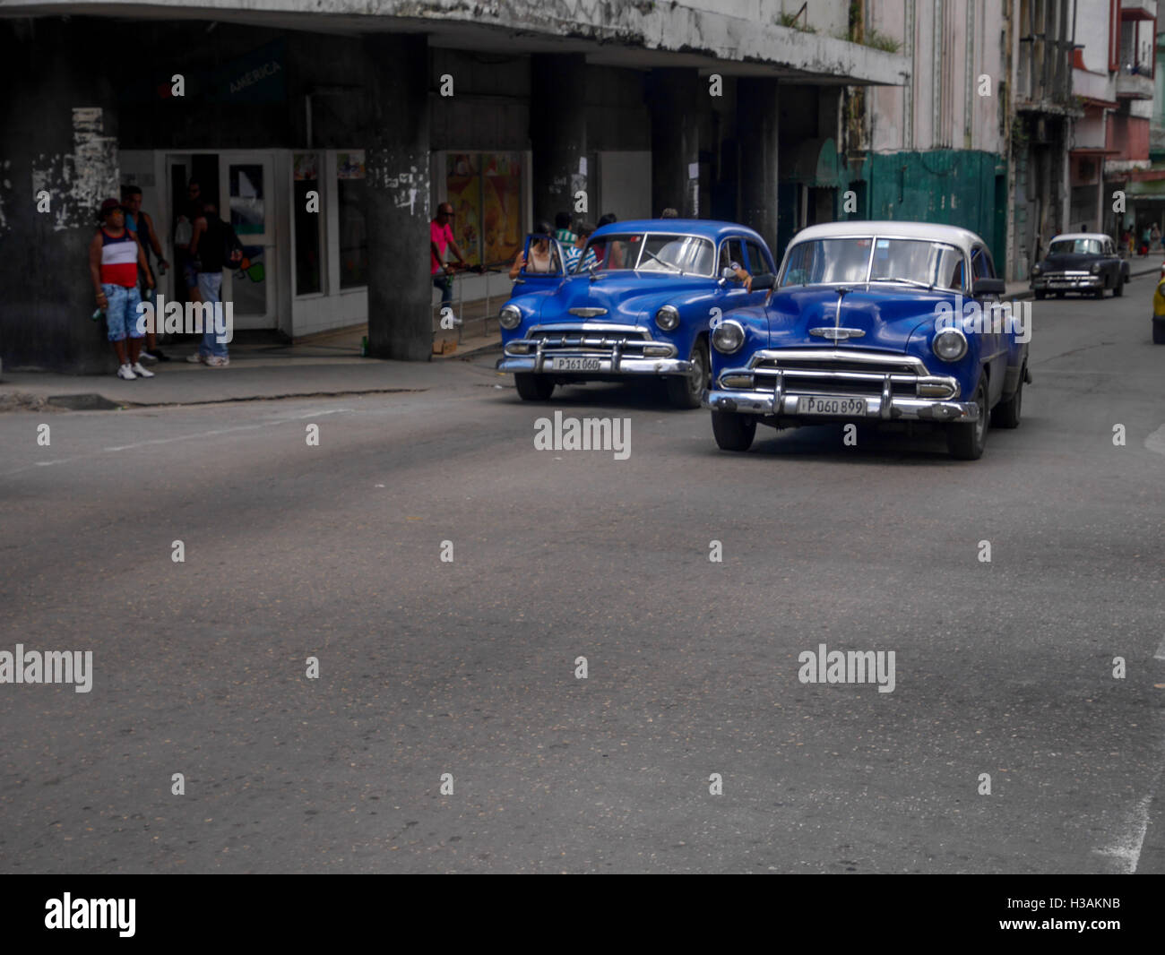 Very busy street life in havana cuba where people are working with tourists and entertaining them in various ways. lots of traffic caused by tourists Stock Photo