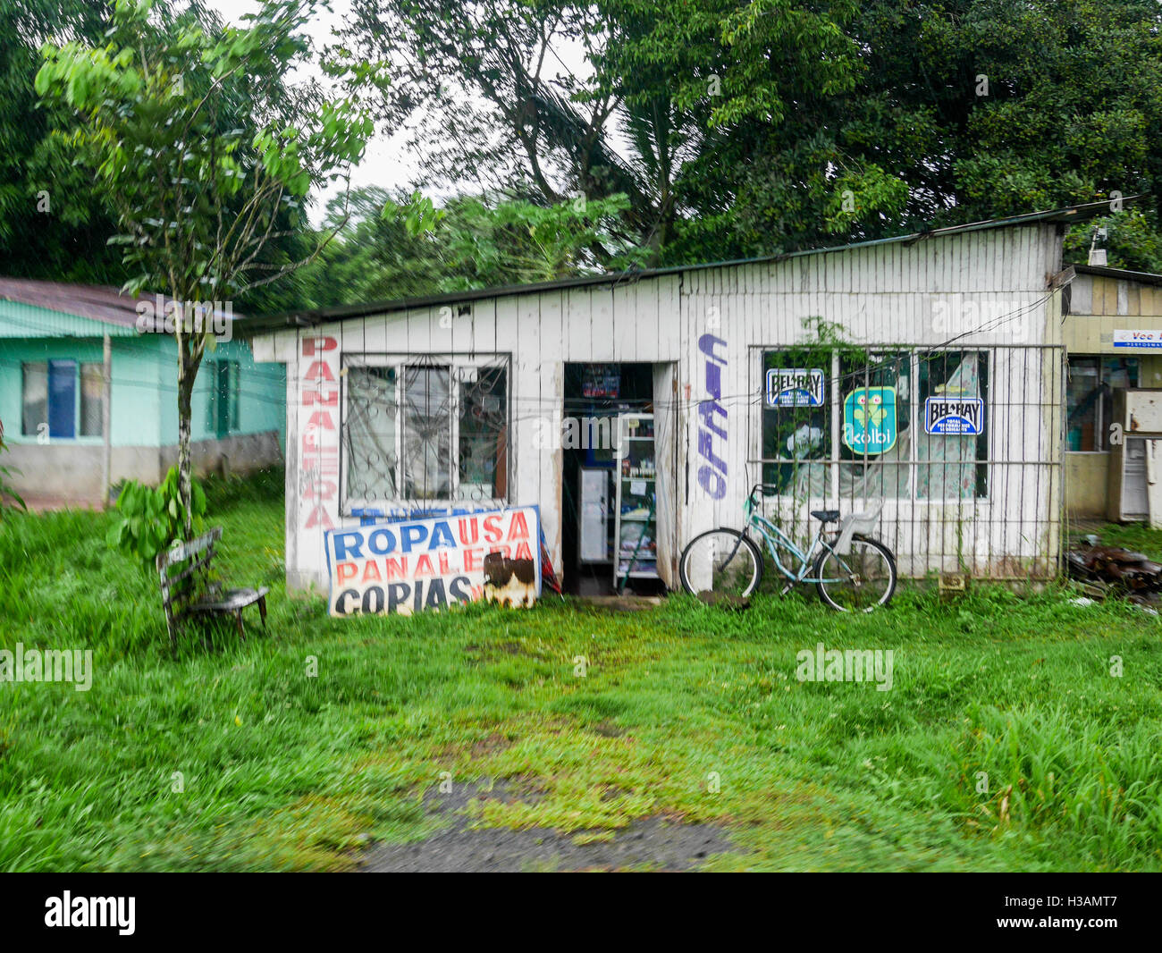Very tiny store in a village in central America in a building that looks abandoned, wooden white structure a main food source for people Stock Photo