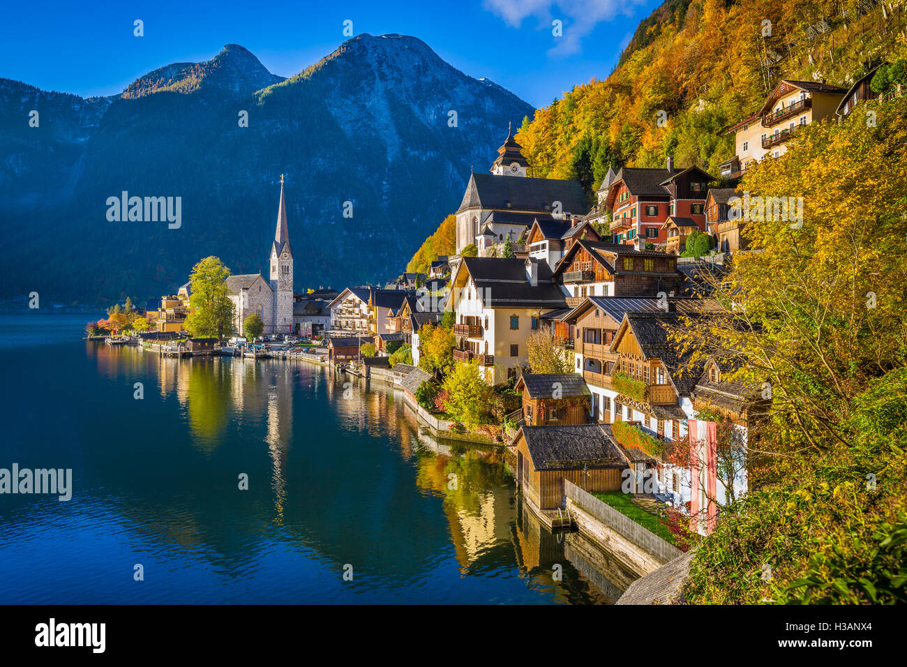 Scenic picture-postcard view of famous Hallstatt mountain village with Hallstaetter Lake in the Alps in fall at sunrise, Austria Stock Photo