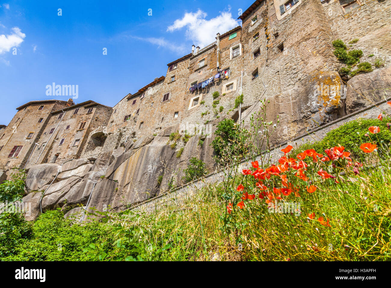 Beautiful view of the medieval town of Vitorchiano on a sunny day with blue sky and clouds in summer, province of Viterbo, Lazio, Italy Stock Photo