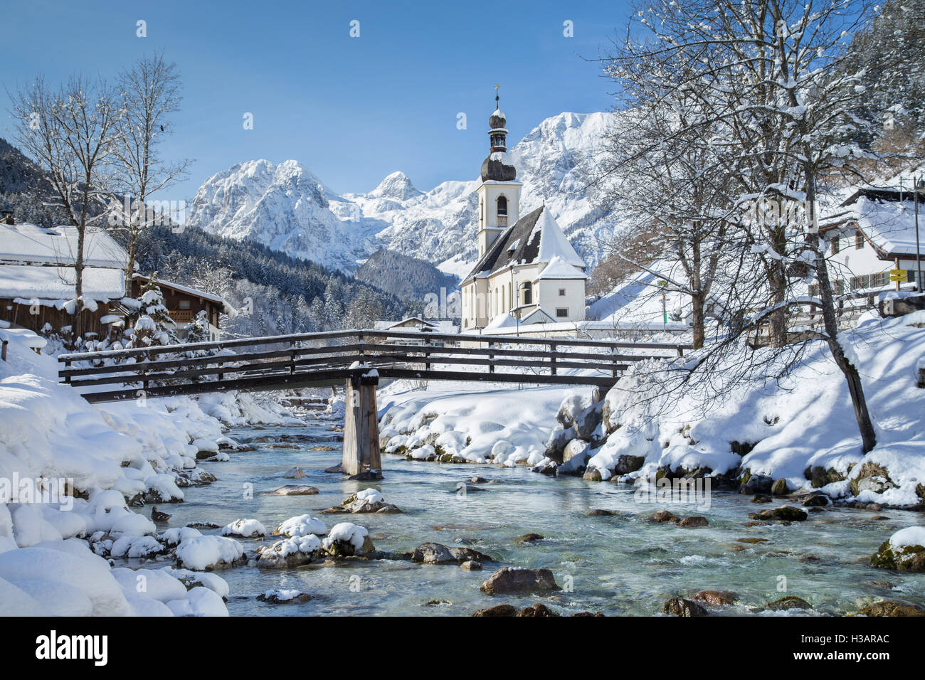 Classic view of famous Church of Ramsau in winter, Berchtesgadener Land, Bavaria, Germany Stock Photo