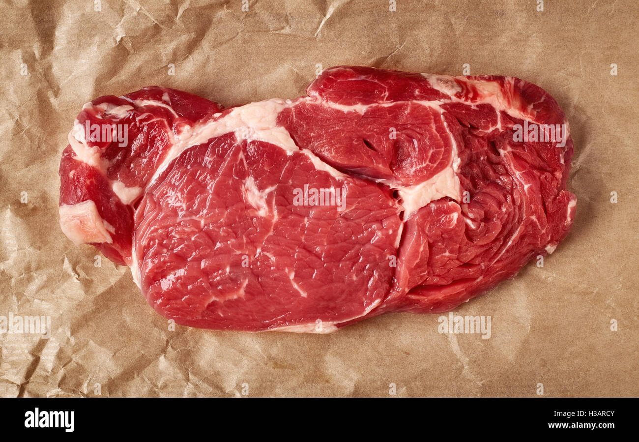 Raw beef steak on recycling paper, top view Stock Photo Alamy