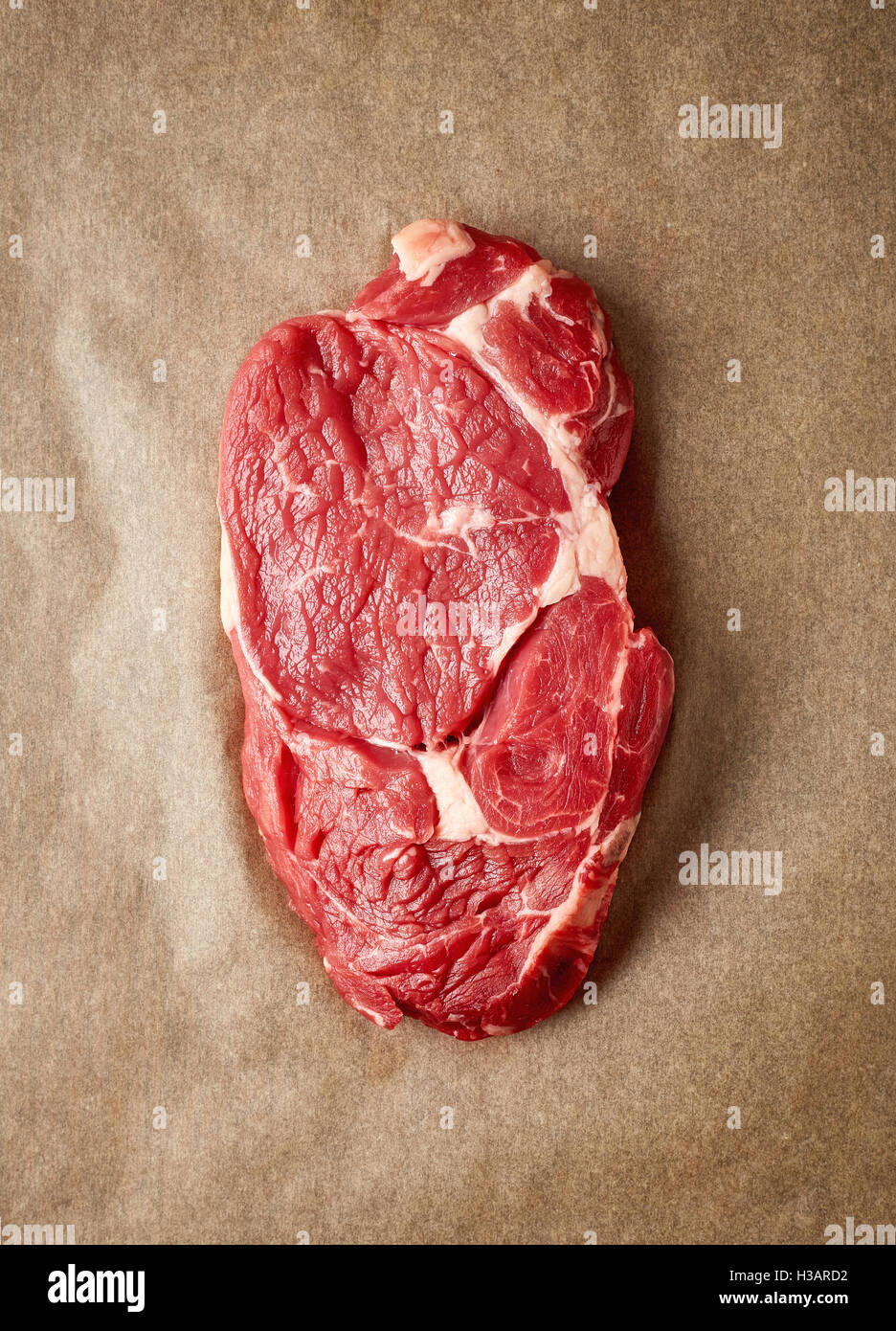 Raw beef steak on recycling paper, top view Stock Photo Alamy