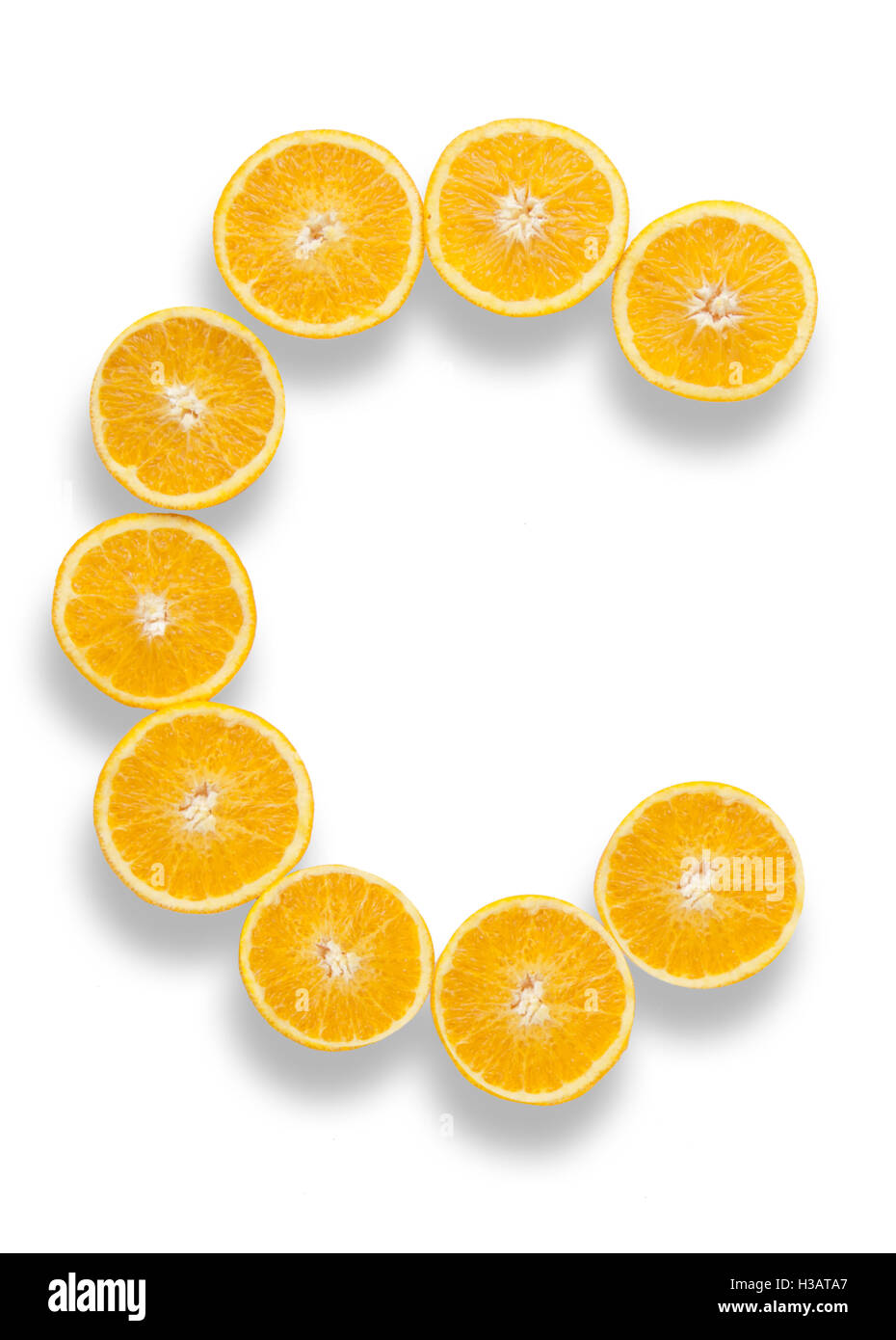 Vitamin C letter made from orange halves over a white background Stock  Photo - Alamy