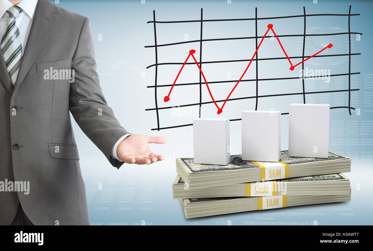 Businessman points hand on white boxes and money Stock Photo Alamy