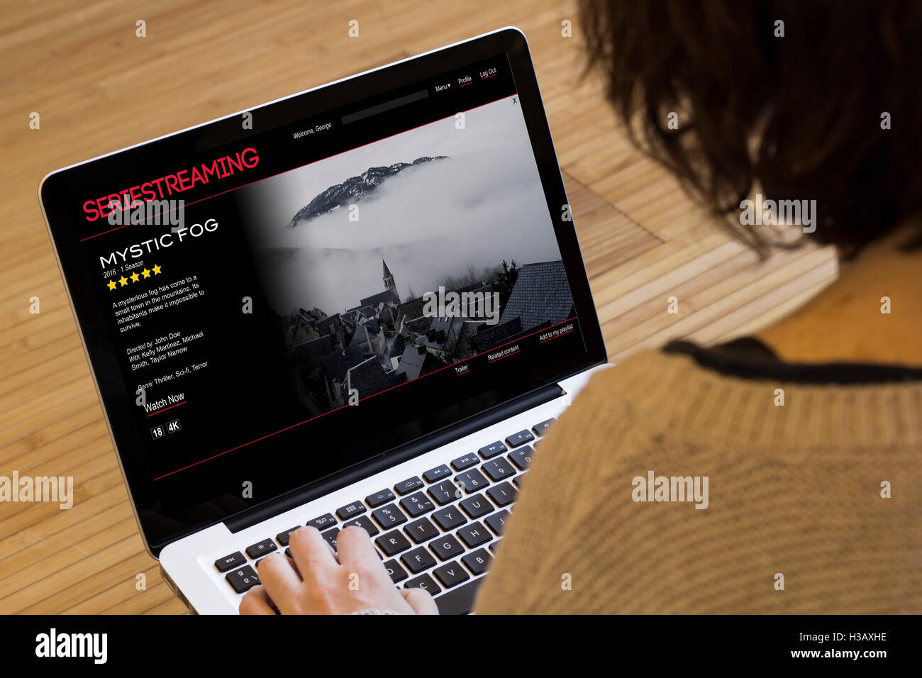 video on demand concept: series streaming on a laptop screen. Screen graphics are made up. Stock Photo