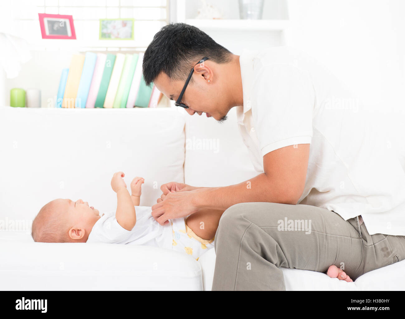 Baby nappy change dad hires stock photography and images Alamy