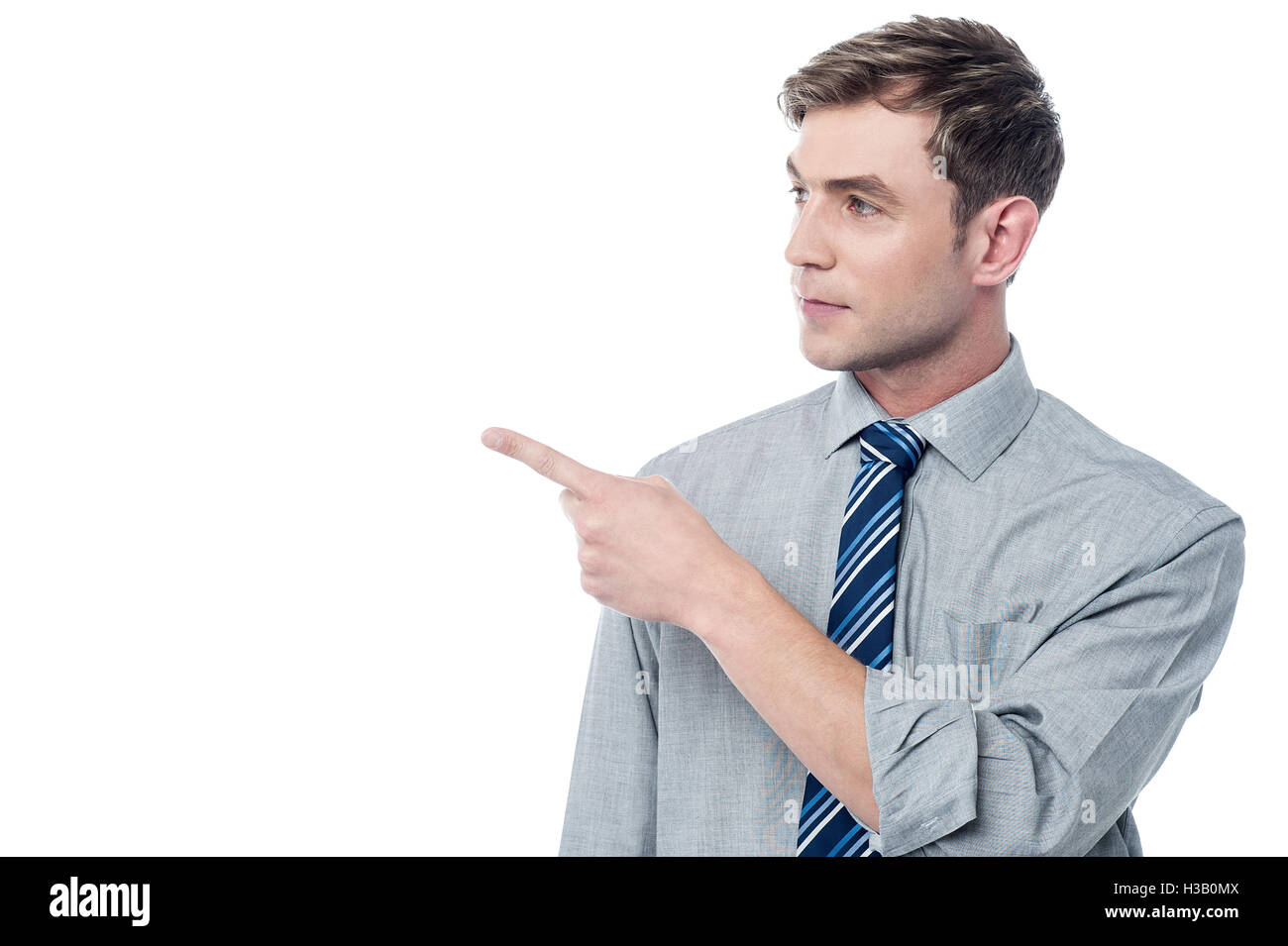 Happy man pointing at something Stock Photo - Alamy