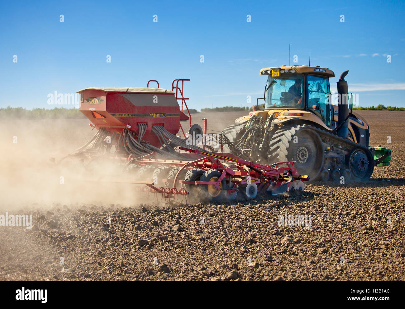 Tractor sowing seed. Stock Photo
